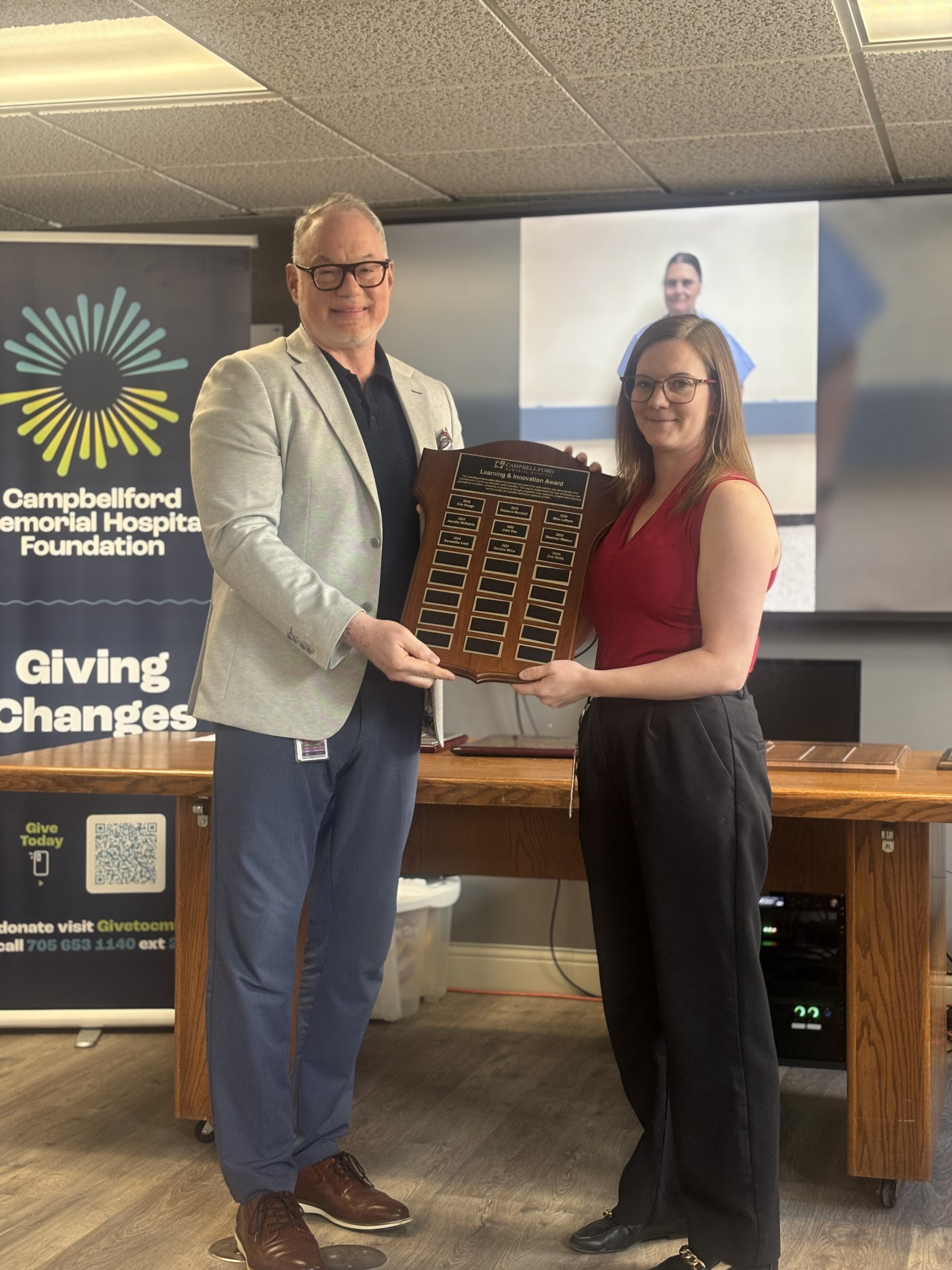 Zoe Neilly receiving award